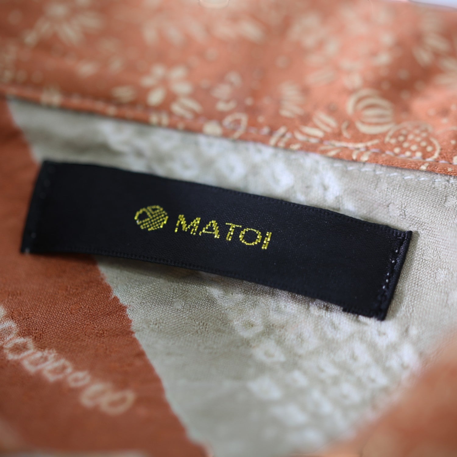 A floral silk shirt worn with a formal kimono