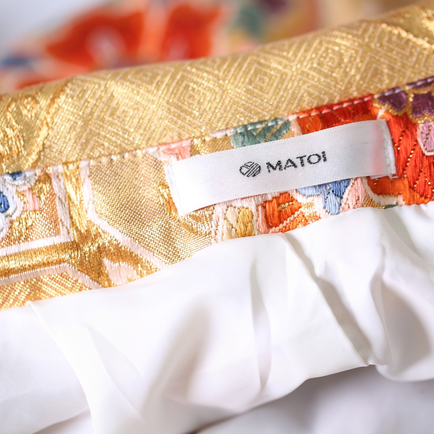 Glossy red furisode and Saga Nishiki pants