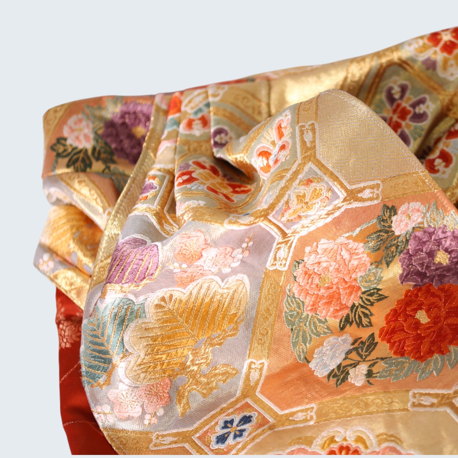 Glossy red furisode and Saga Nishiki pants