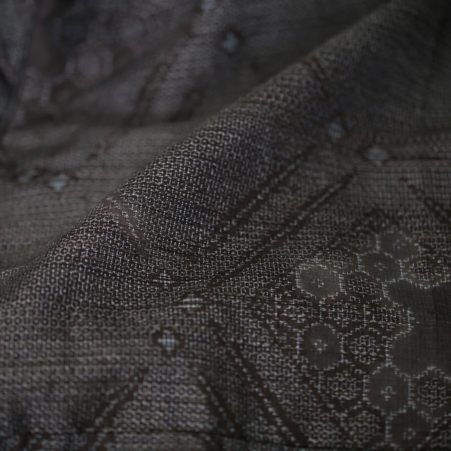 A glossy haori coat made from authentic Yuki Tsumugi silk