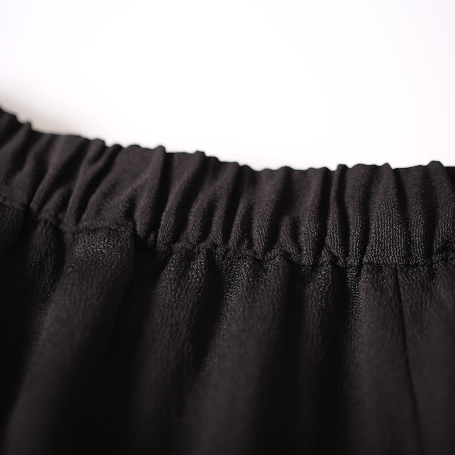 A dignified skirt in jet black and gold with butterflies fluttering about
