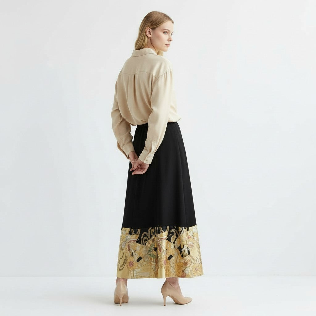 A dignified skirt in jet black and gold with butterflies fluttering about