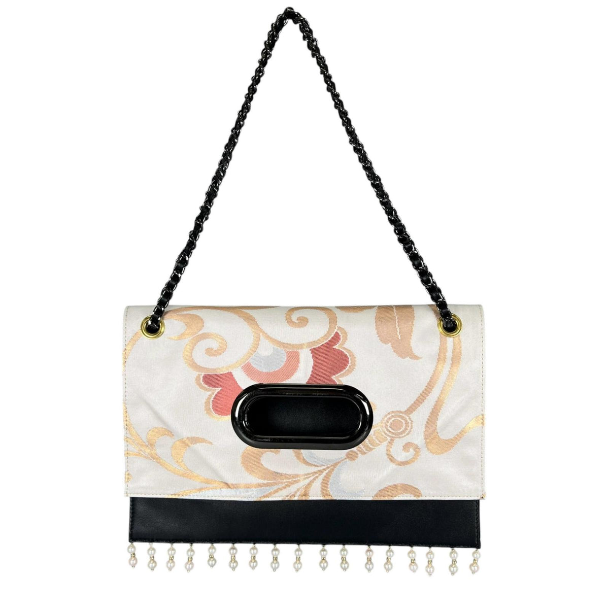 A Clutch Bag made from a vintage obi, breathing new life into a floral arabesque pattern.