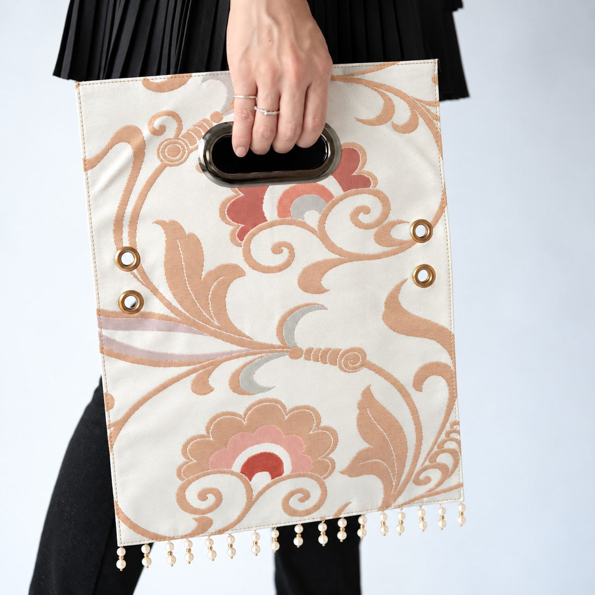 A Clutch Bag made from a vintage obi, breathing new life into a floral arabesque pattern.