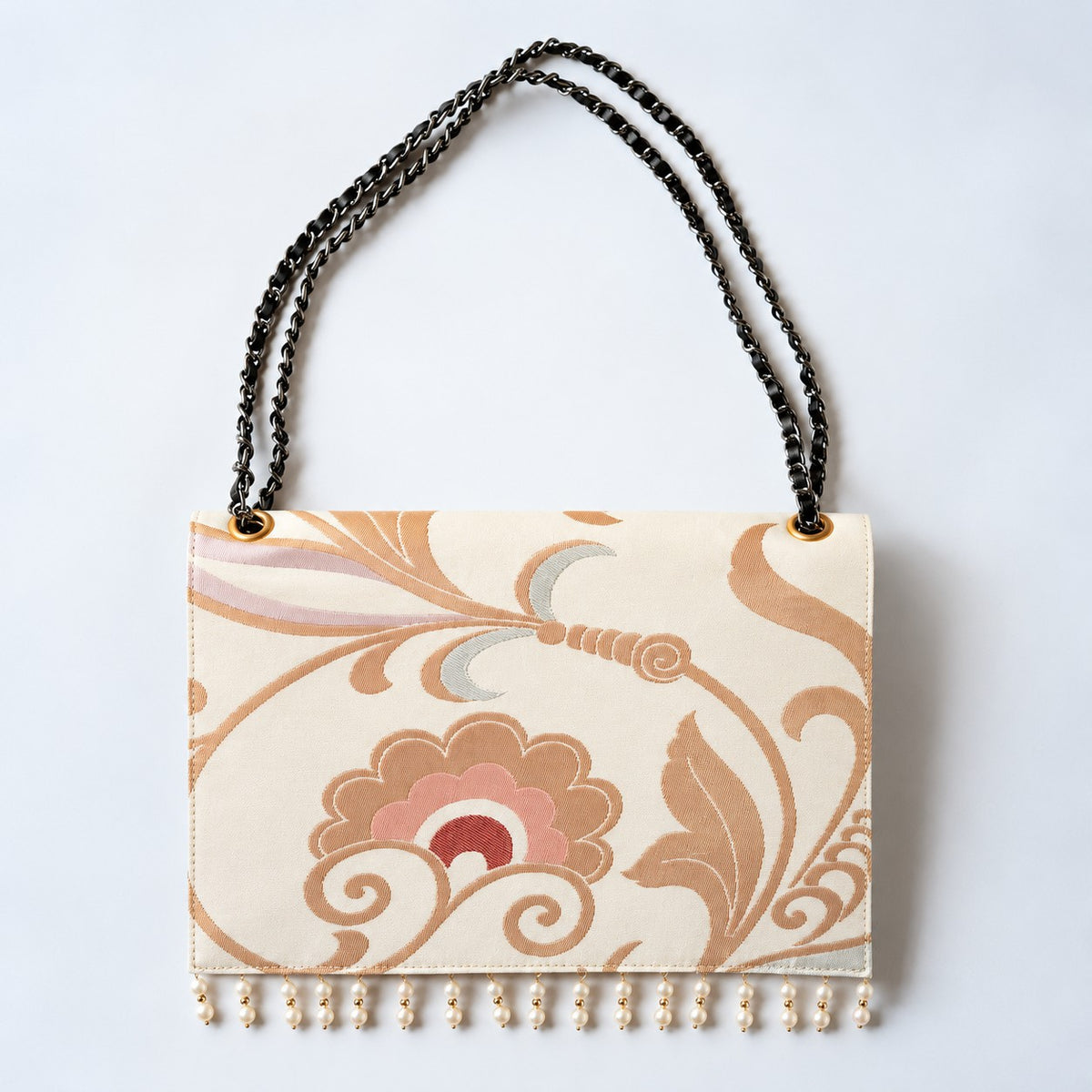 A Clutch Bag made from a vintage obi, breathing new life into a floral arabesque pattern.