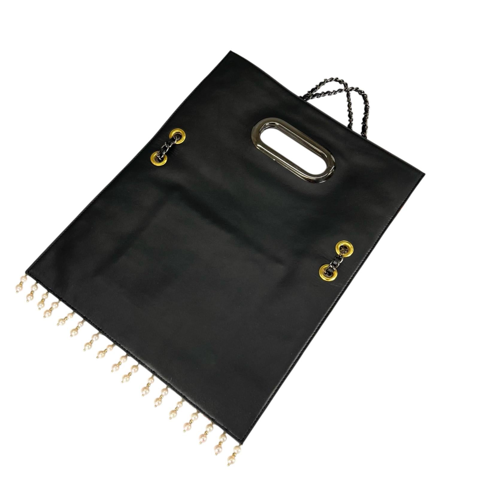 Clutch bag crafted from a vintage obi, adorned with the brilliance of the wisteria crest.