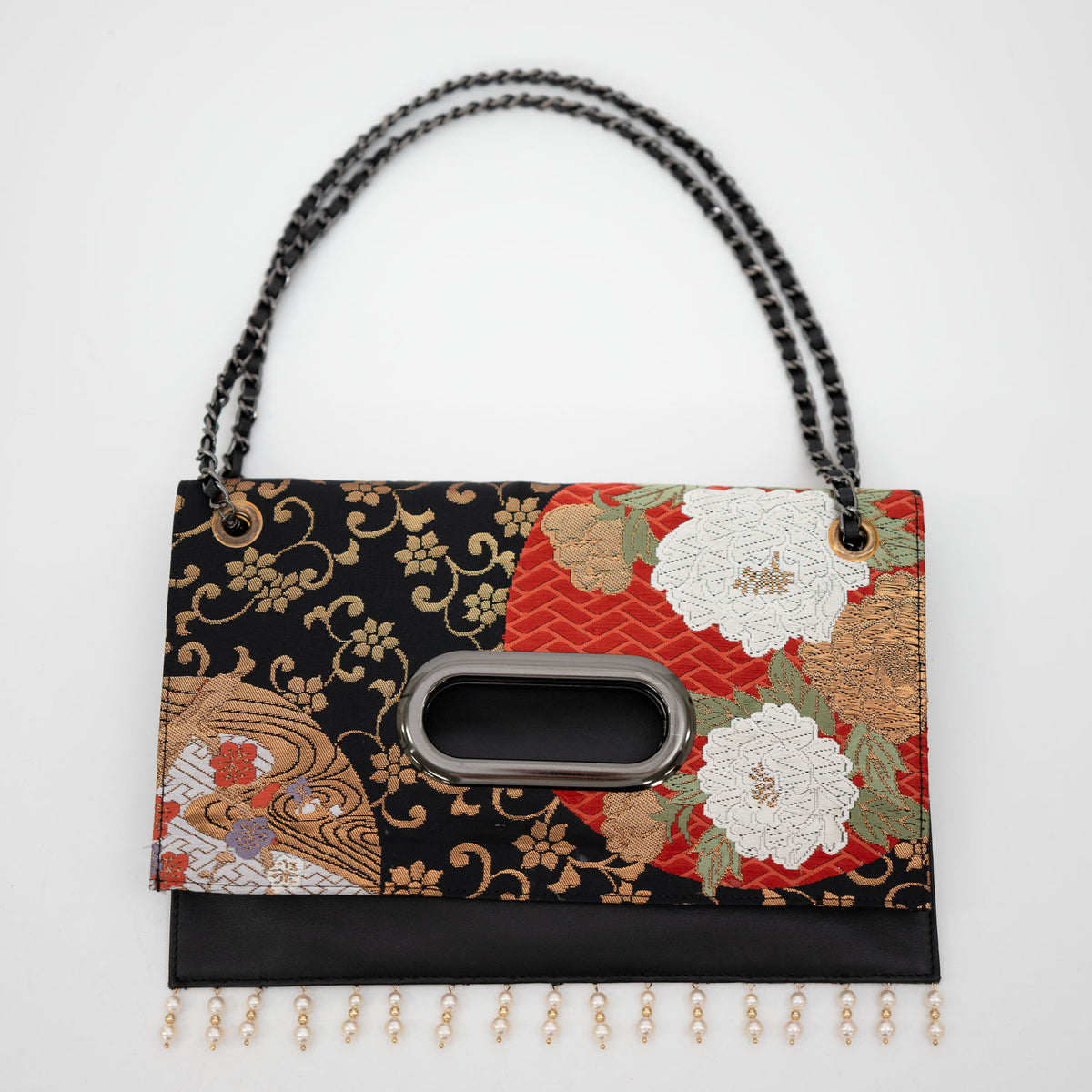 Clutch bag crafted from a vintage obi, adorned with the brilliance of the wisteria crest.