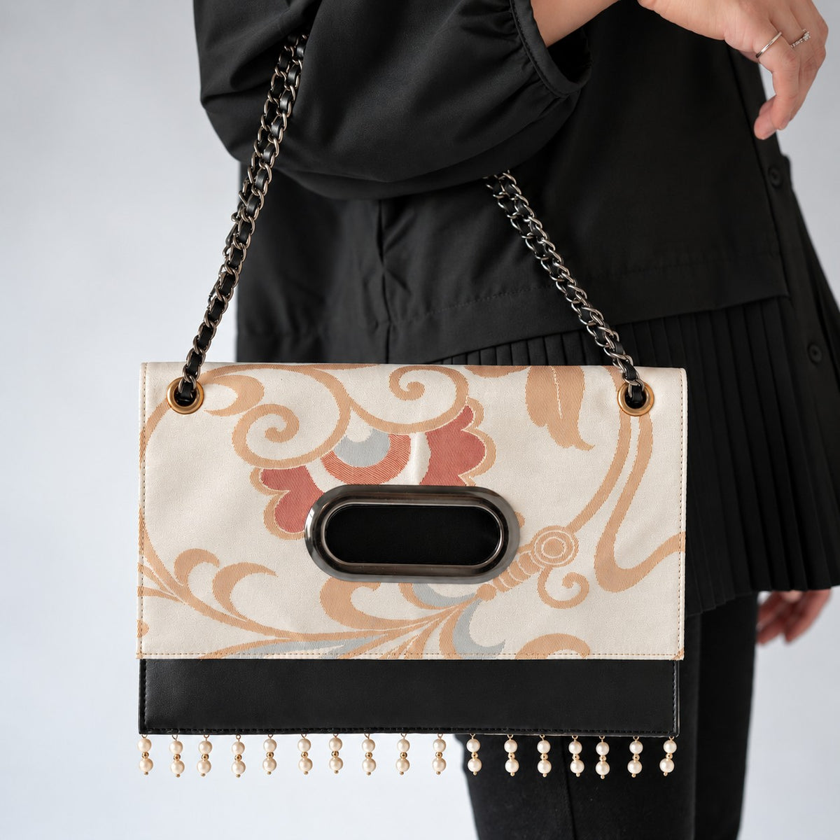 A Clutch Bag made from a vintage obi, breathing new life into a floral arabesque pattern.
