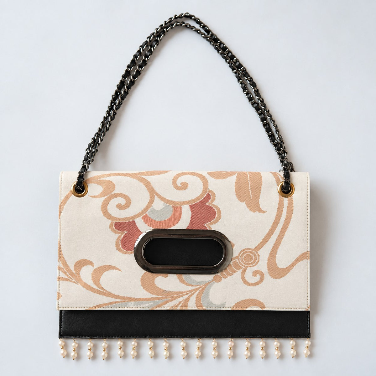 A Clutch Bag made from a vintage obi, breathing new life into a floral arabesque pattern.