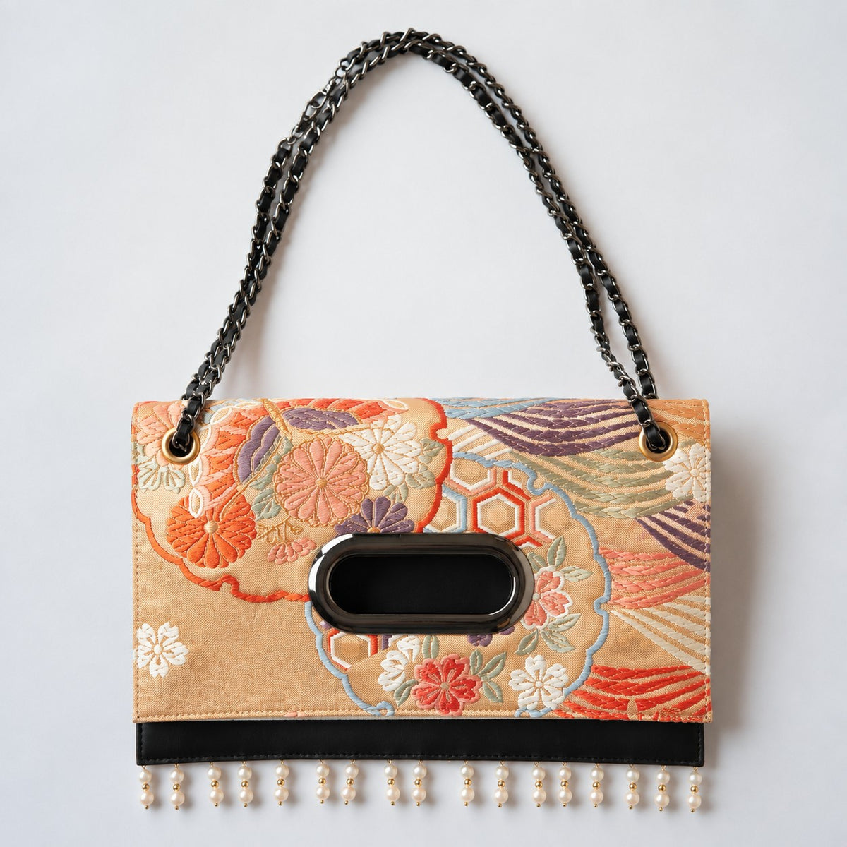 Clutch bag with dancing flowers in a snow ring and Akoya pearls, the ultimate in elegance