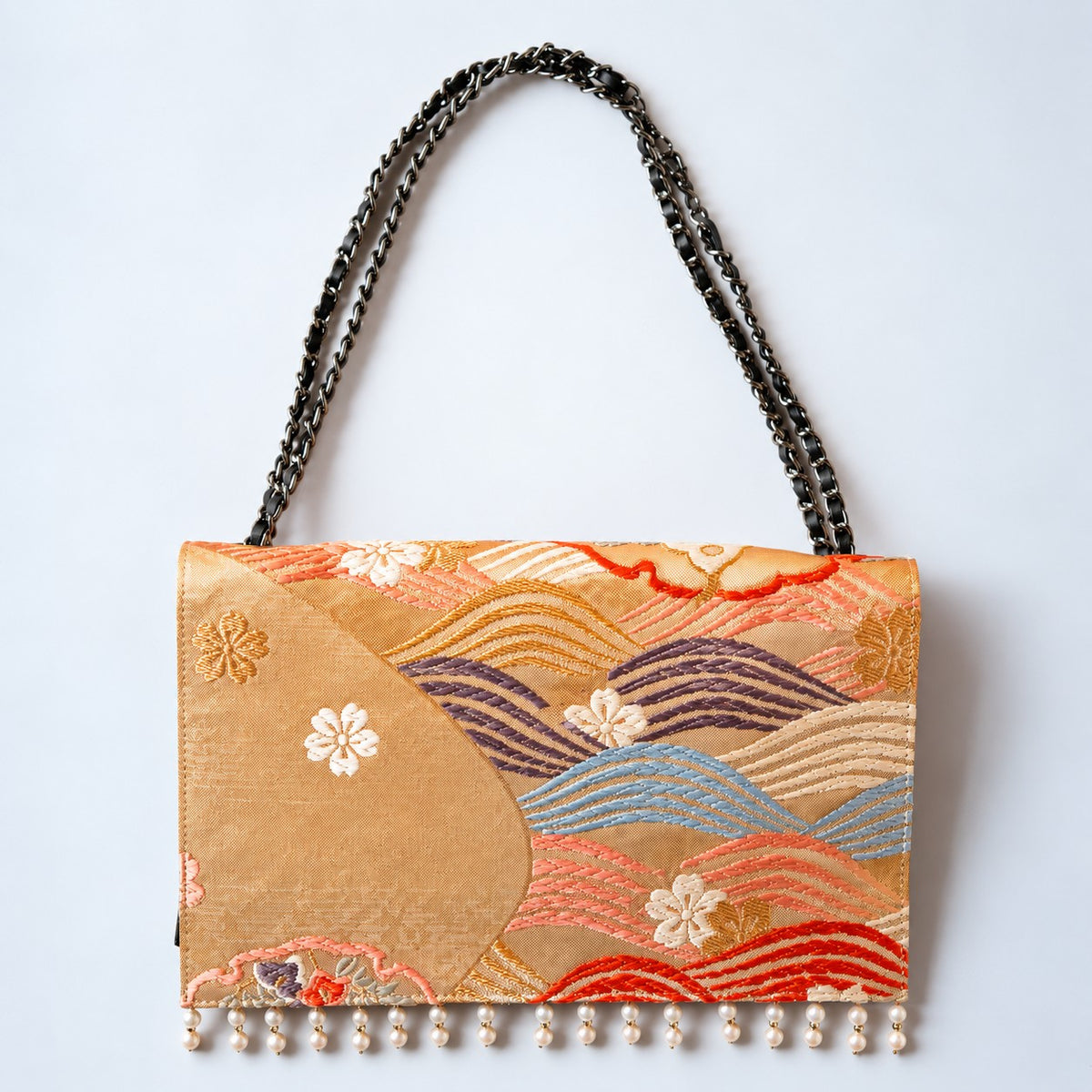 Clutch bag with dancing flowers in a snow ring and Akoya pearls, the ultimate in elegance